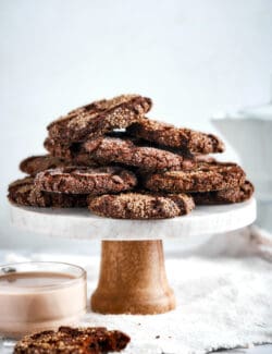 espresso cookies piled on a pedestal platter