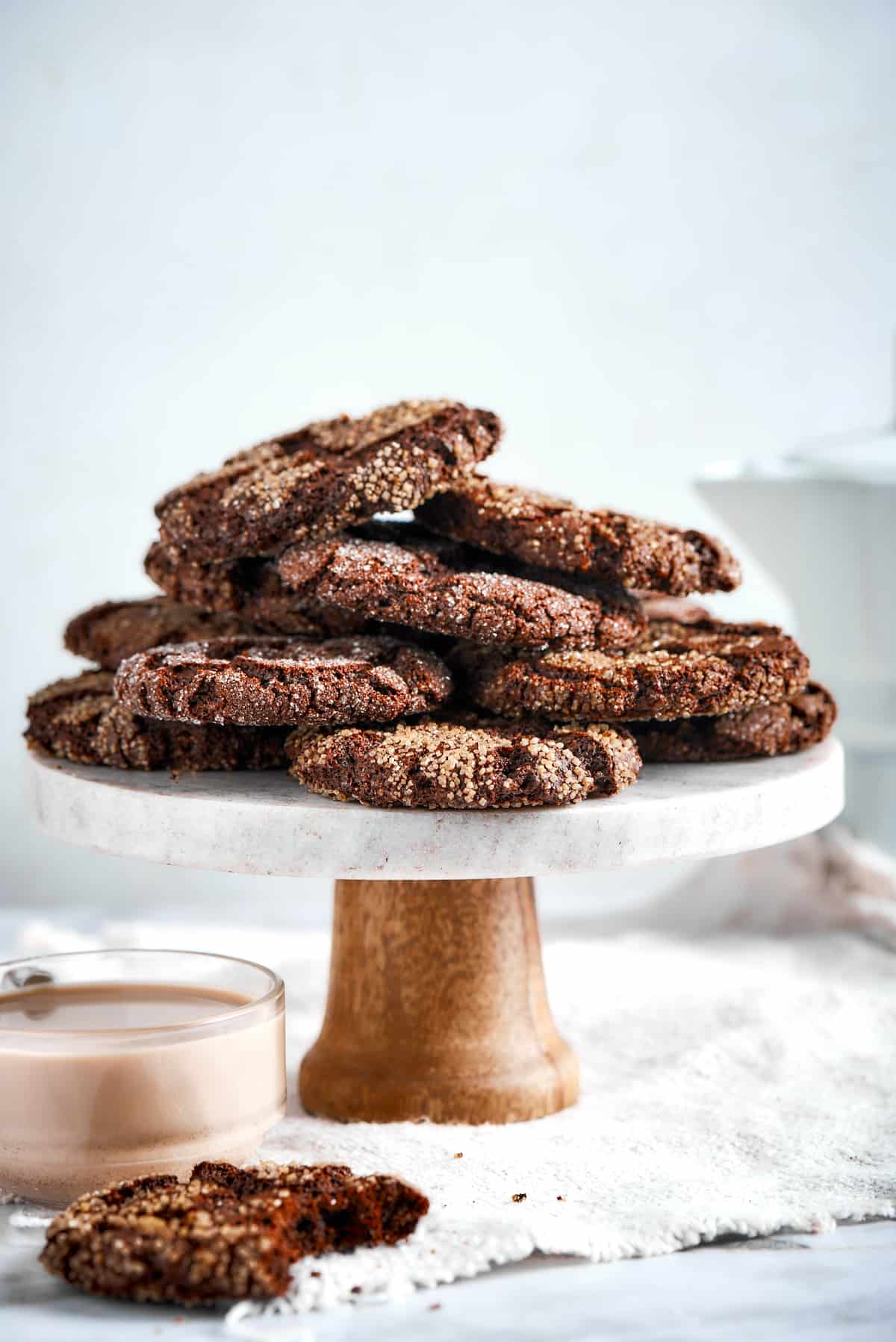 espresso cookies piled on a pedestal platter