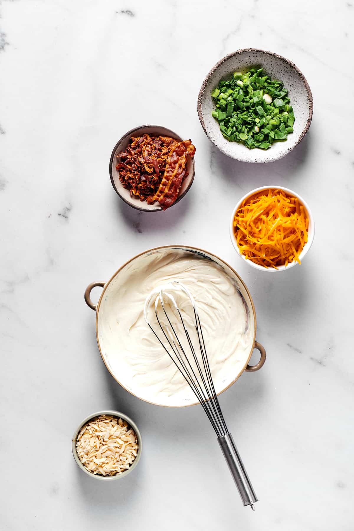 Cream cheese and mayonnaise mixed in a bowl