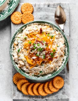 Overhead view of a bowl of Neiman Marcus dip with Ritz crackers