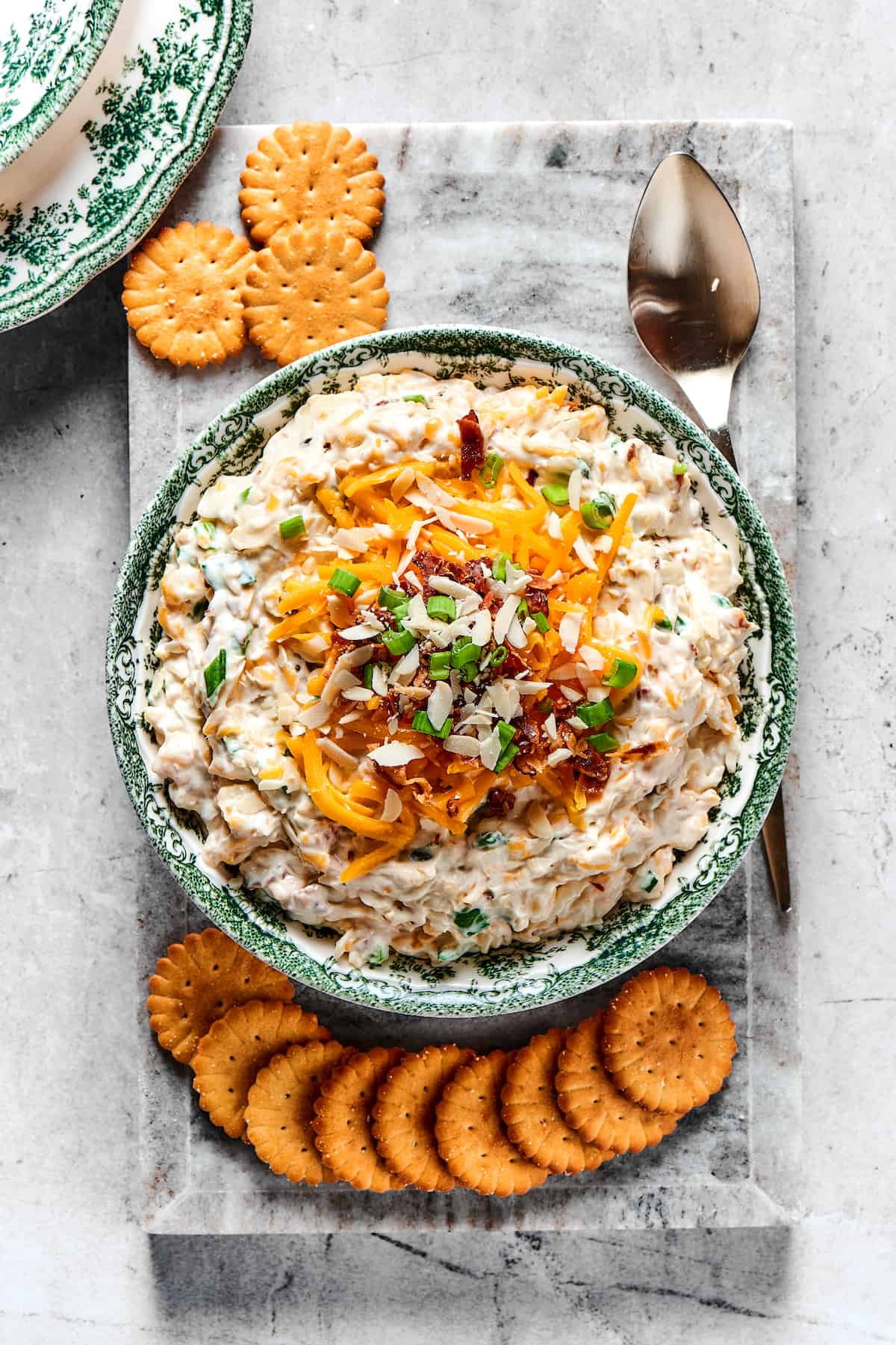 Overhead view of a bowl of Neiman Marcus dip with Ritz crackers