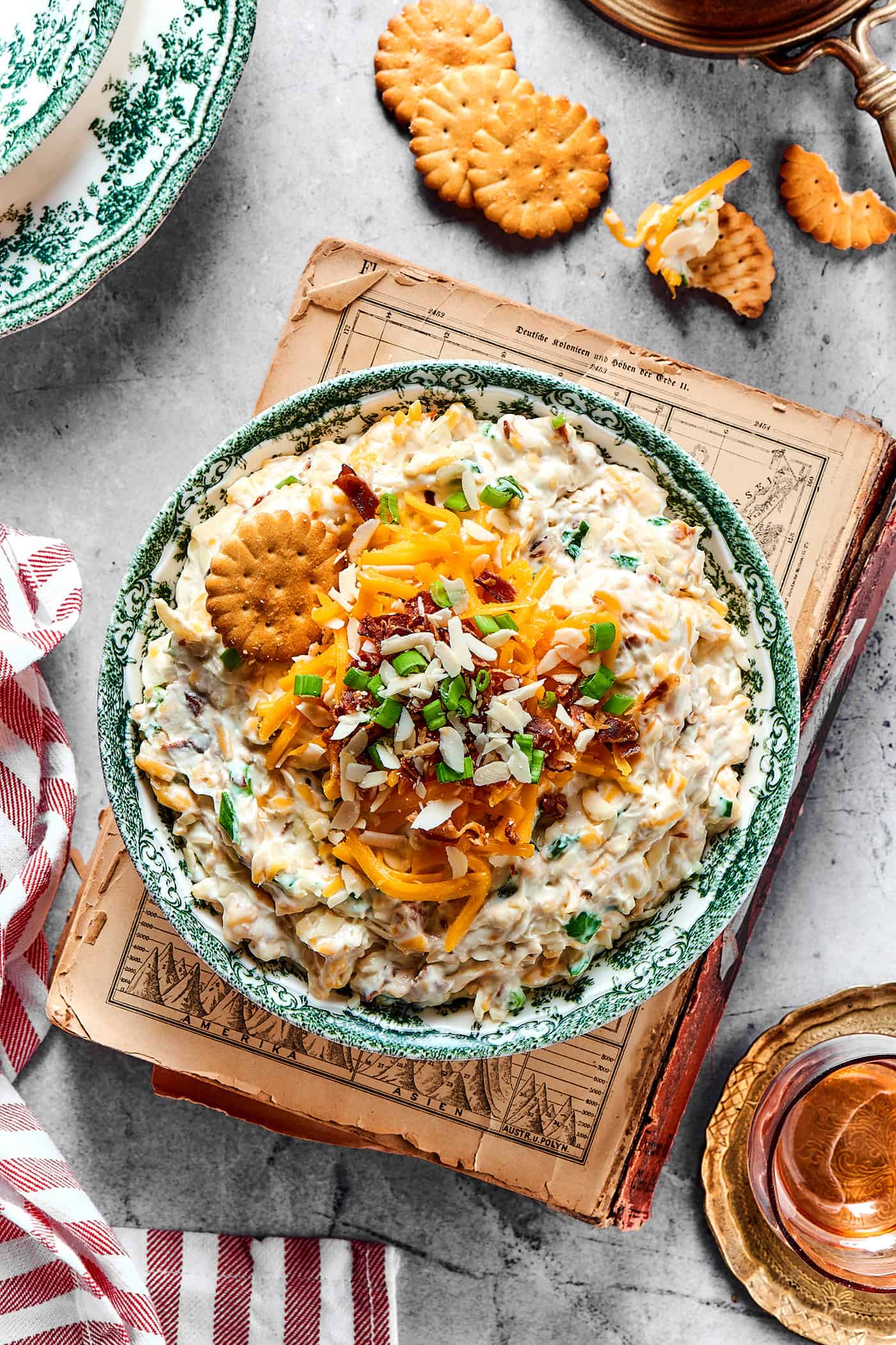 overhead photo of a creamy, cheesy dip in a serving bowl