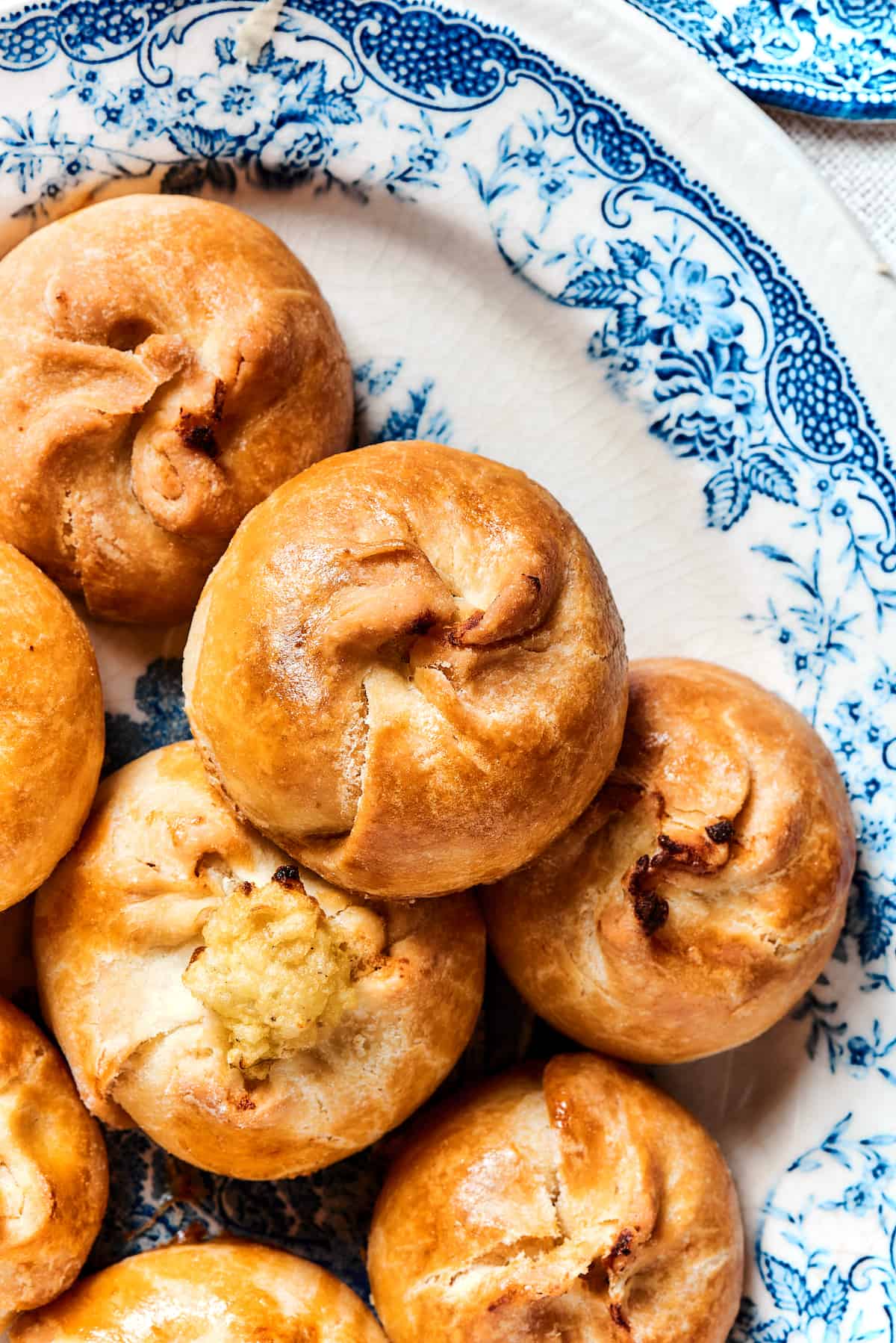 Close up of a plate of potato knishes