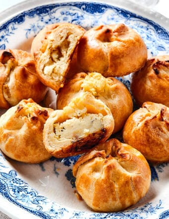 a platter of New York knishes, with one cut in half