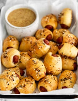 Overhead view of everything bagel pigs in a blanket in a tray
