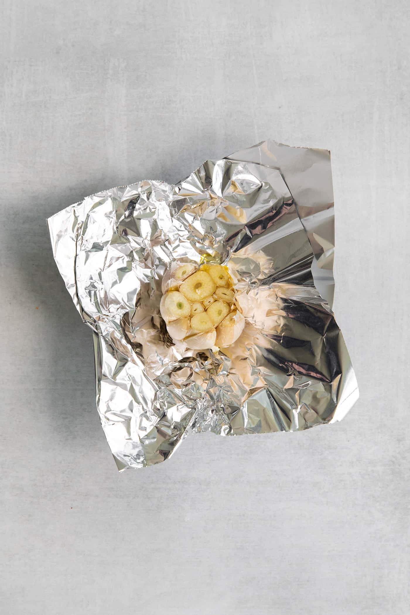 A head of garlic on a piece foil