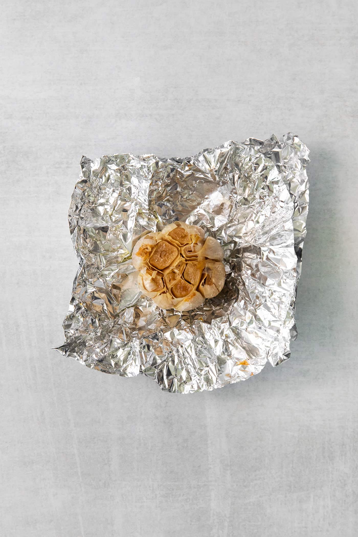 Roasted garlic on a piece of foil