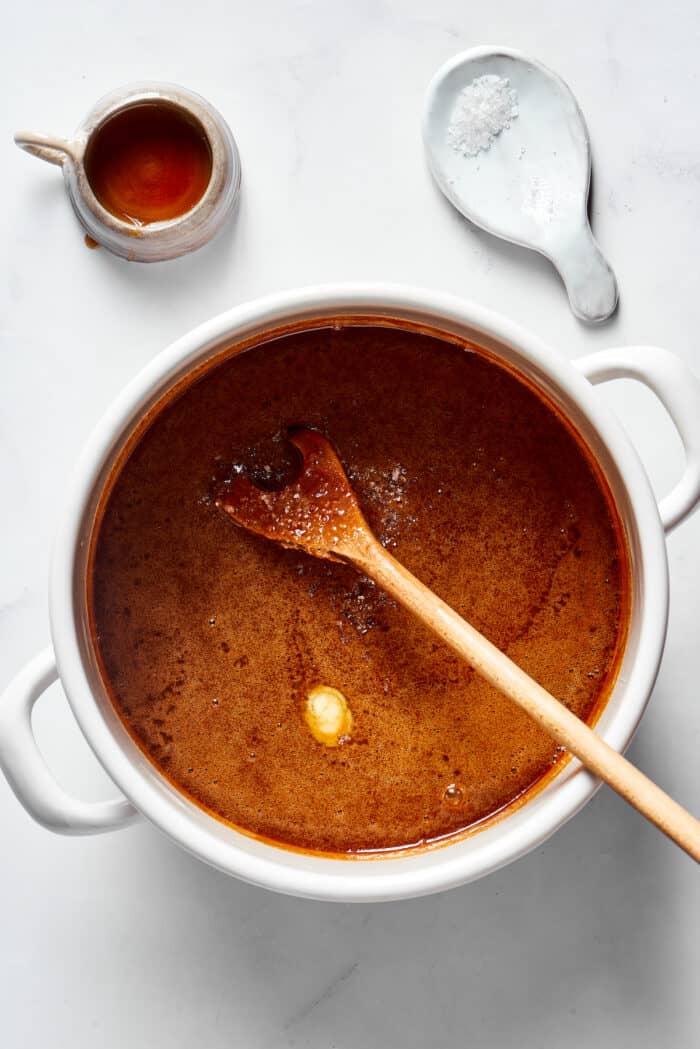 A wooden spoon stirring a praline mixture