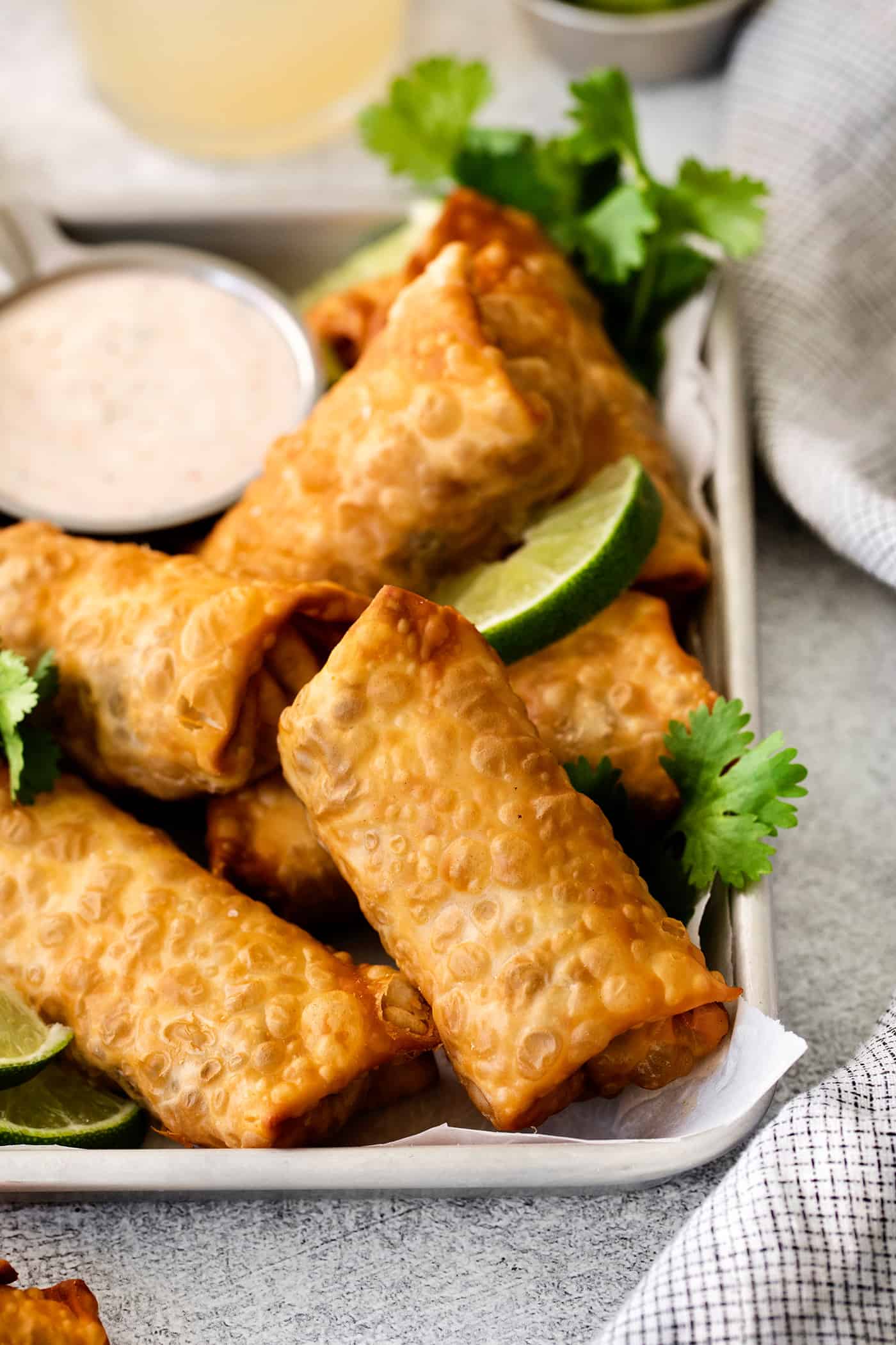 Egg rolls on the corner of a tray