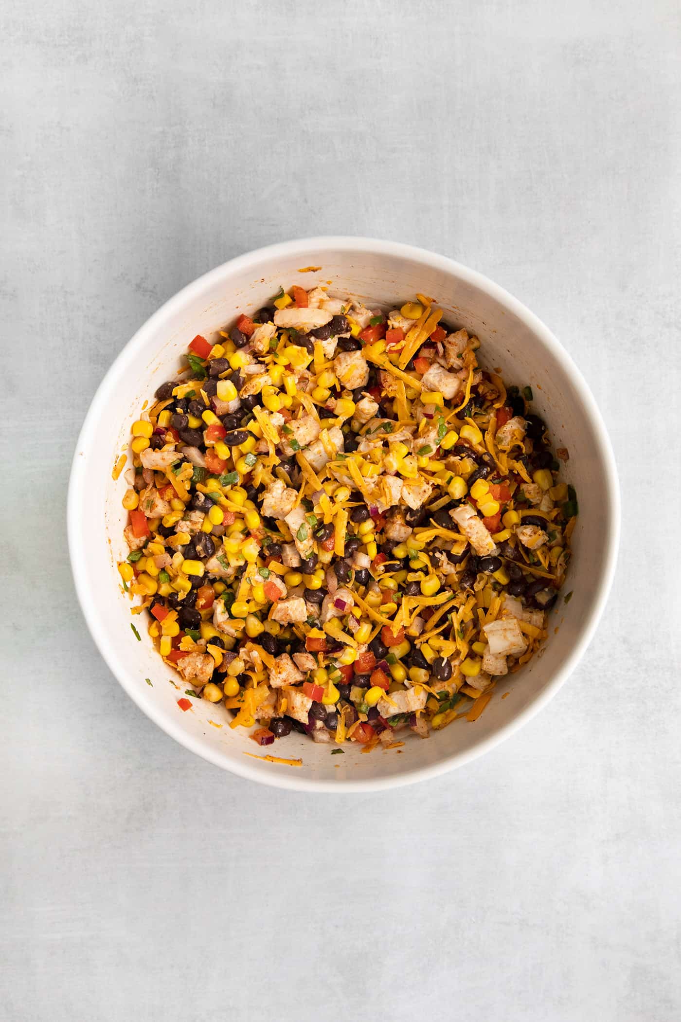 Southwest chicken egg roll ingredients combined in a bowl