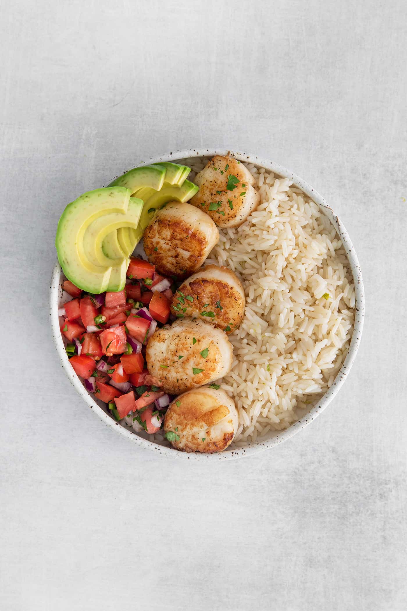 Overhead view of a scallop rice bowl