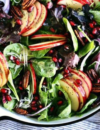 winter apple salad with candied pecans in a large bowl