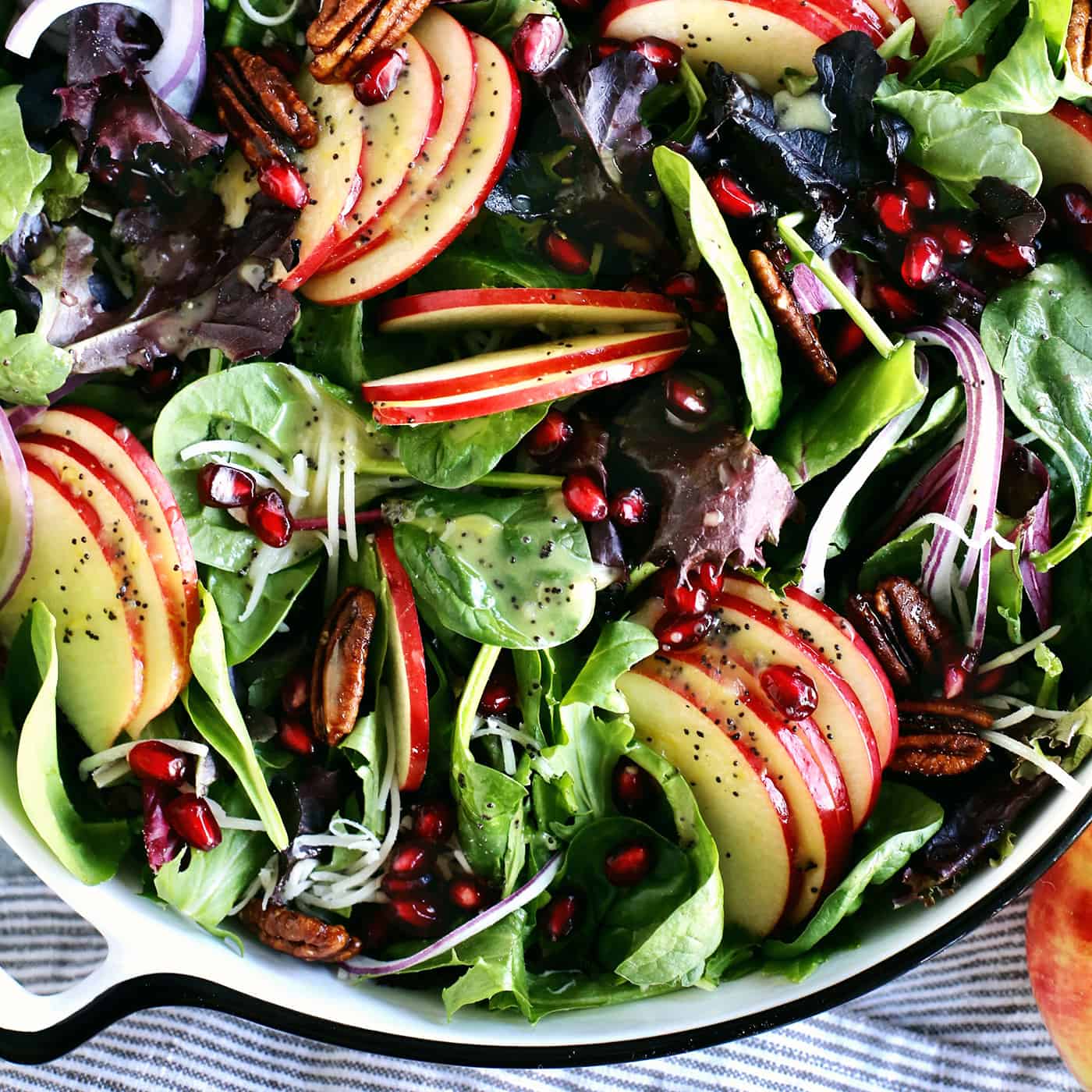 winter apple salad with candied pecans in a large bowl