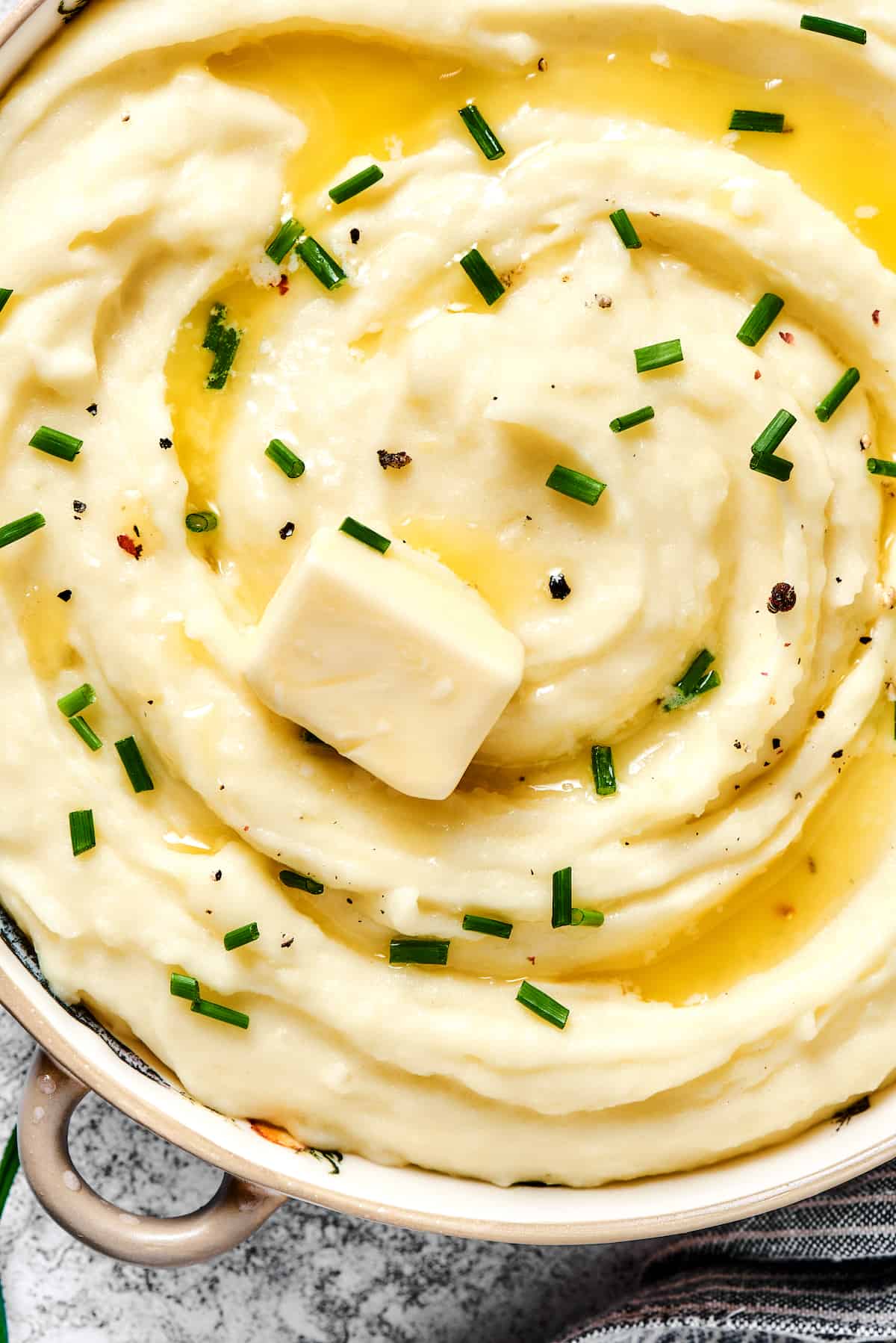 Close up of mashed potatoes with butter and chives