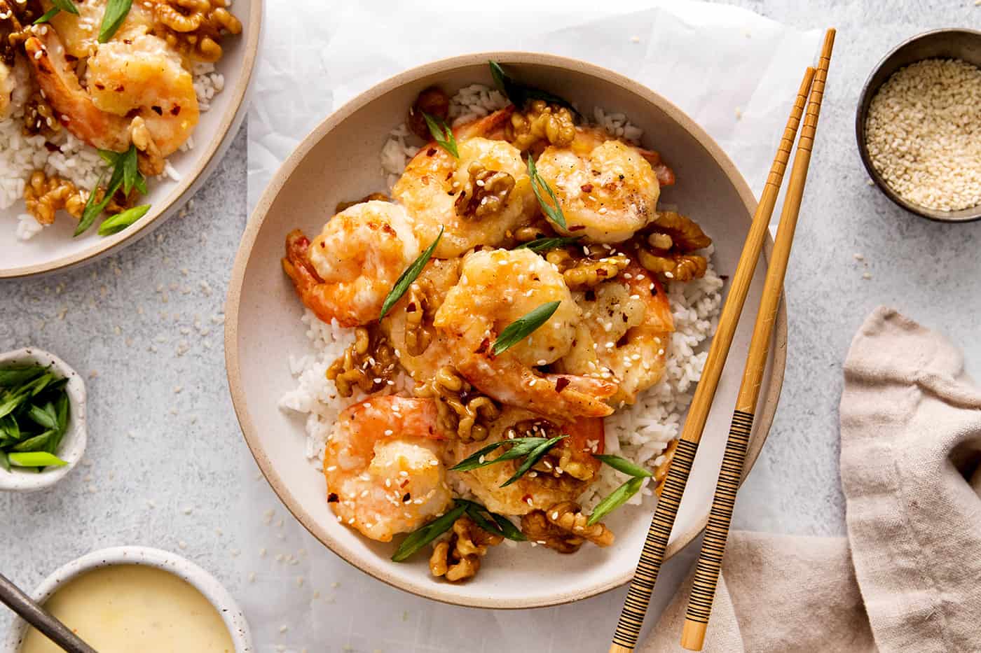 Overhead view fo a plate of honey walnut shrimp over rice