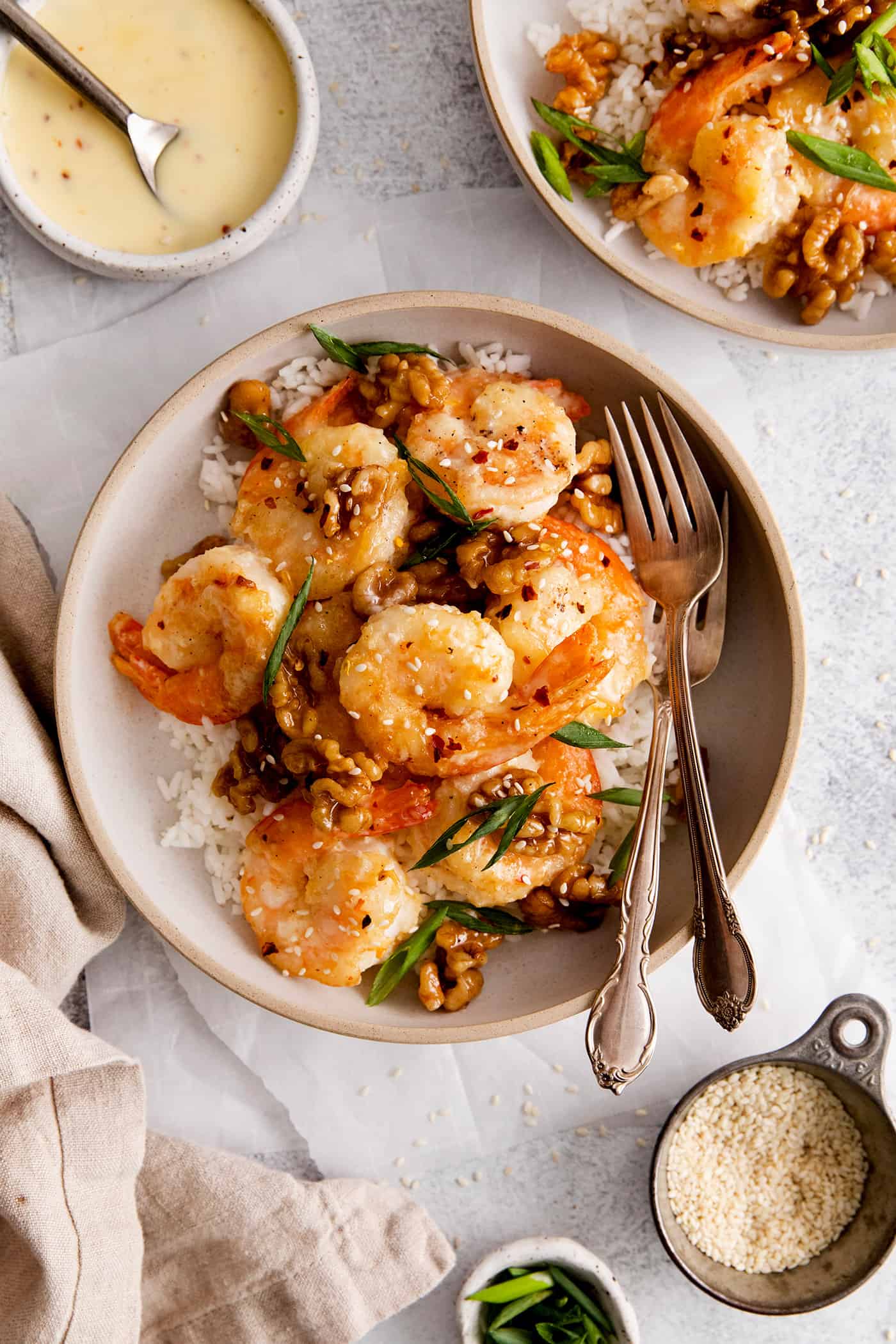 Overhead view of a plate of honey walnut shrimp over rice