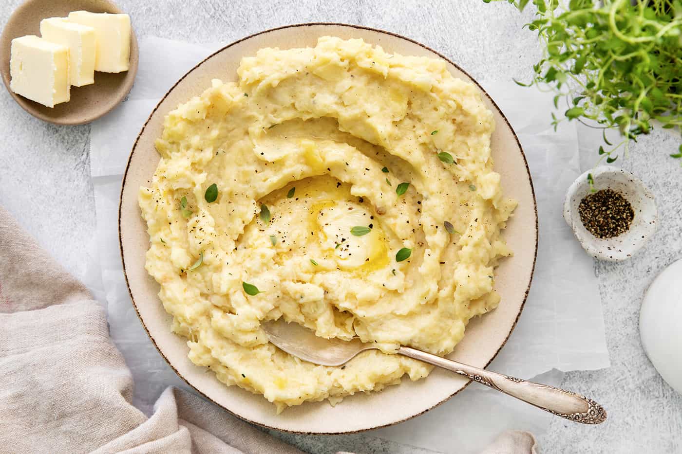 overhead photo of bowl of parsnip puree with melted butter