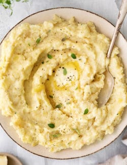 a bowl of parsnip puree with melted butter