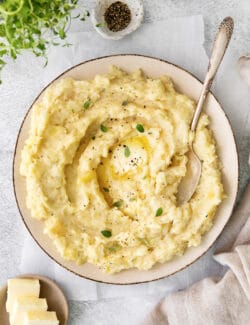 a big bowl of mashed parsnips with melty butter