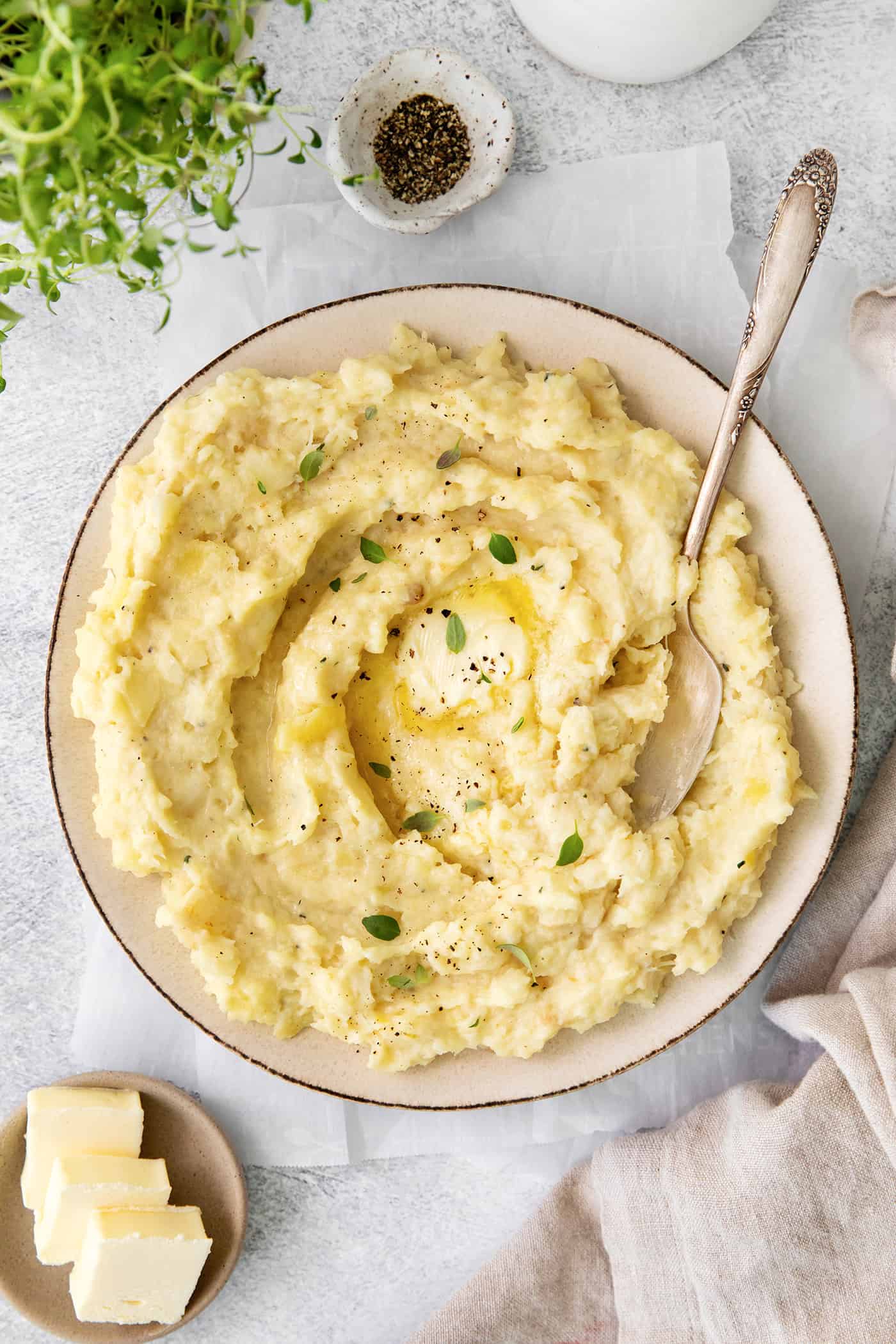 a big bowl of mashed parsnips with melty butter