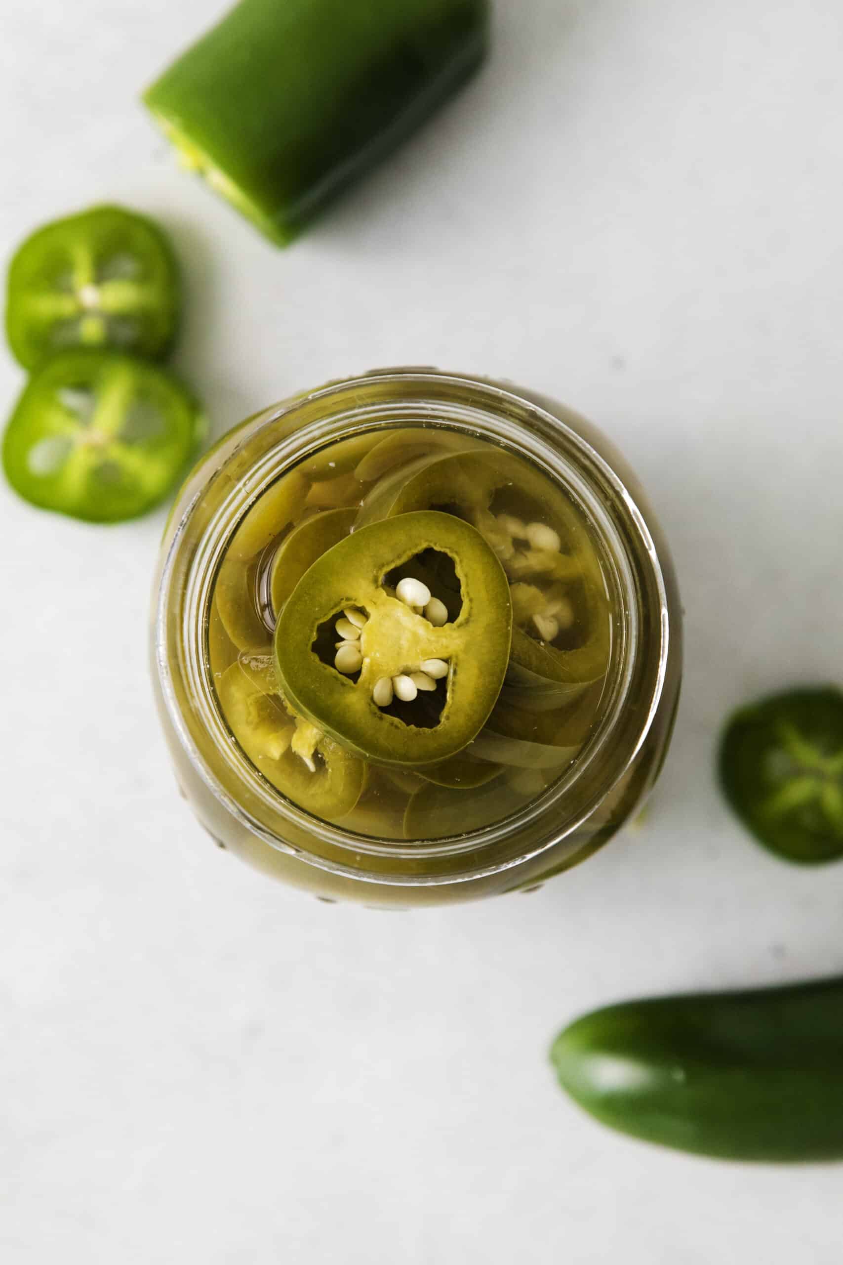 Overhead view of a jar of jalapenos