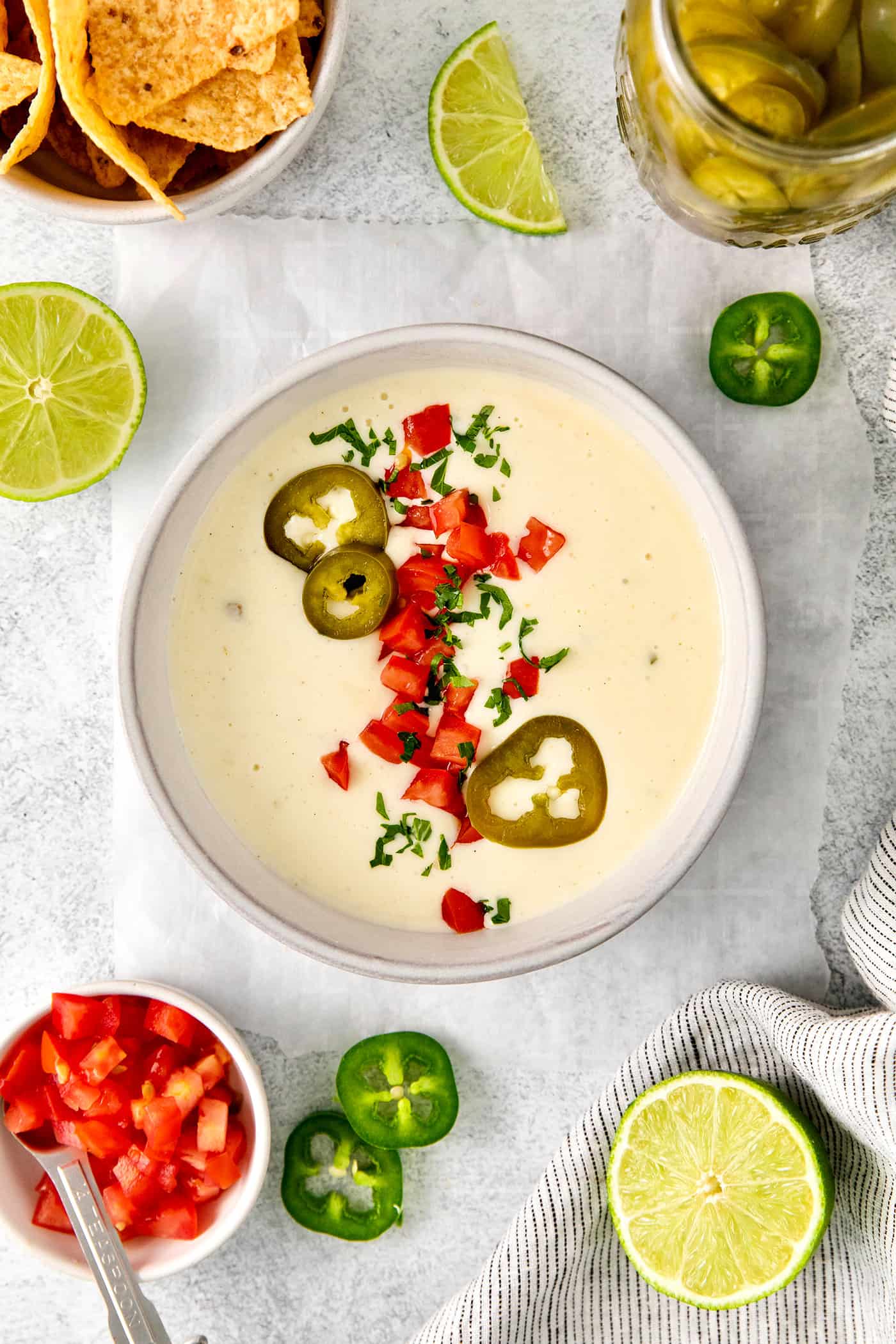 A bowl of white queso dip