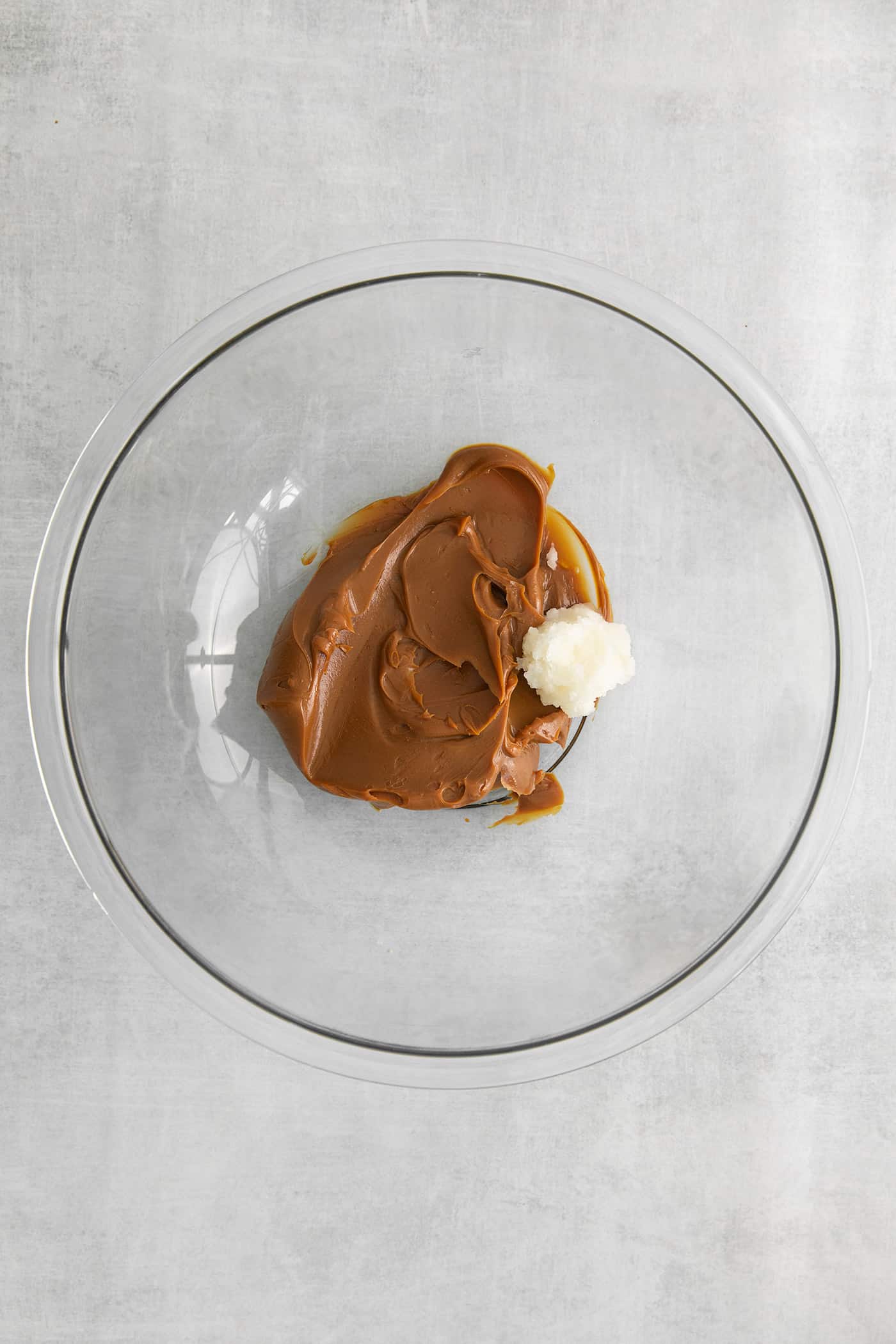 Dulce de leche in a bowl with coconut oil