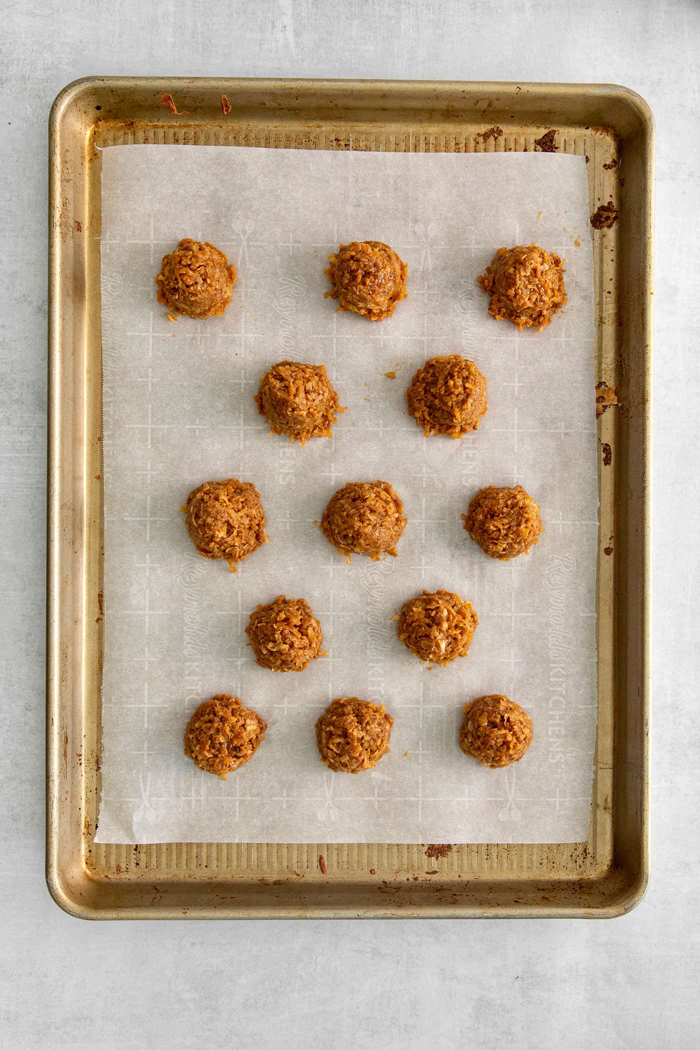 Dulce de leche macaroons on a baking sheet