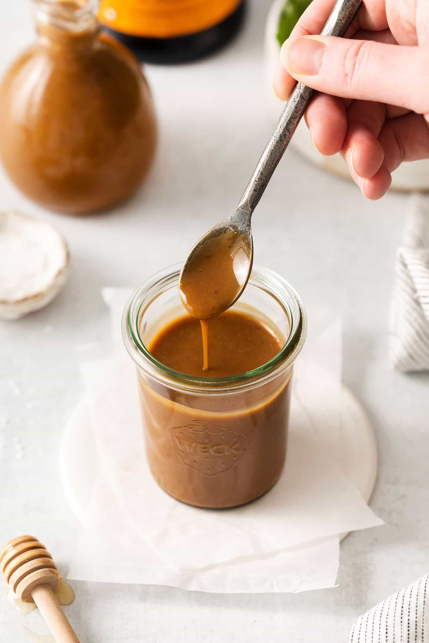 A spoon of vinaigrette over a jar of it