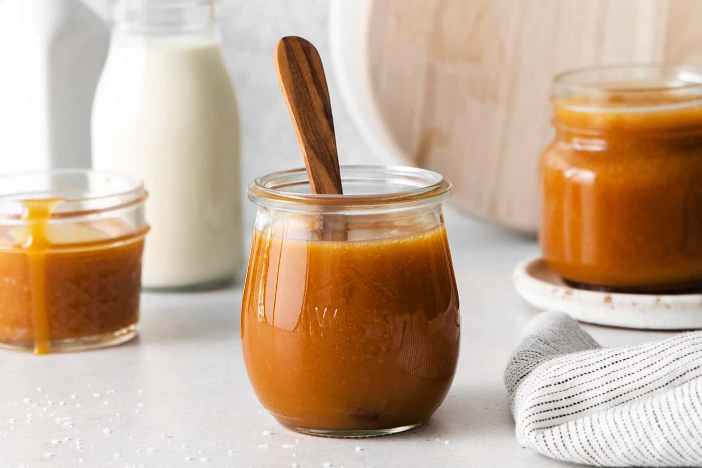 A glass jar of caramel buttermilk syrup