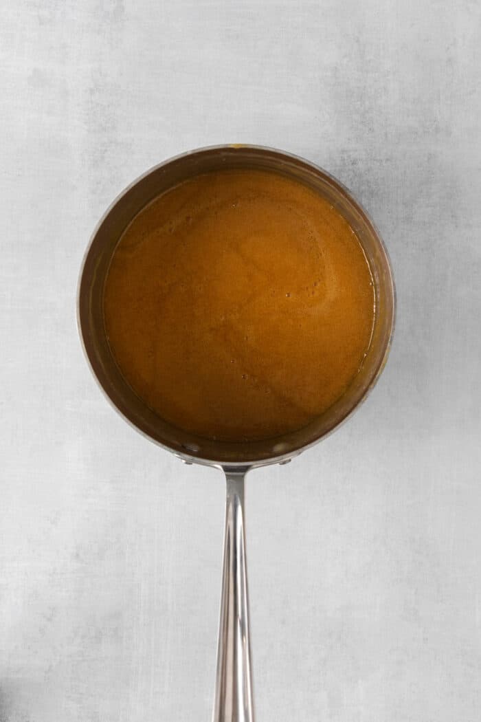 Buttermilk caramel sauce in a saucepan