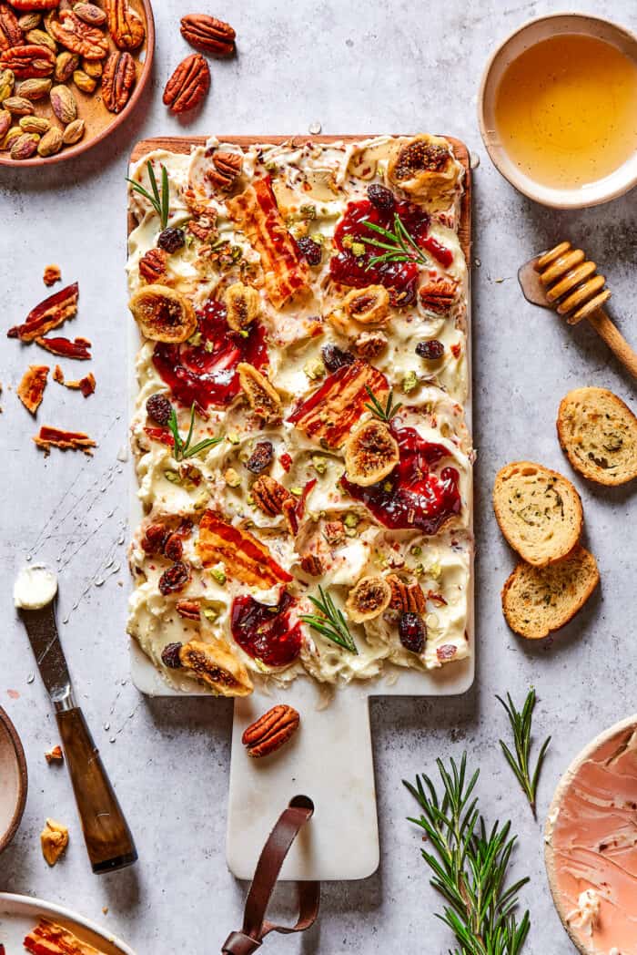 Overhead view of a butter charcuterie board with bacon