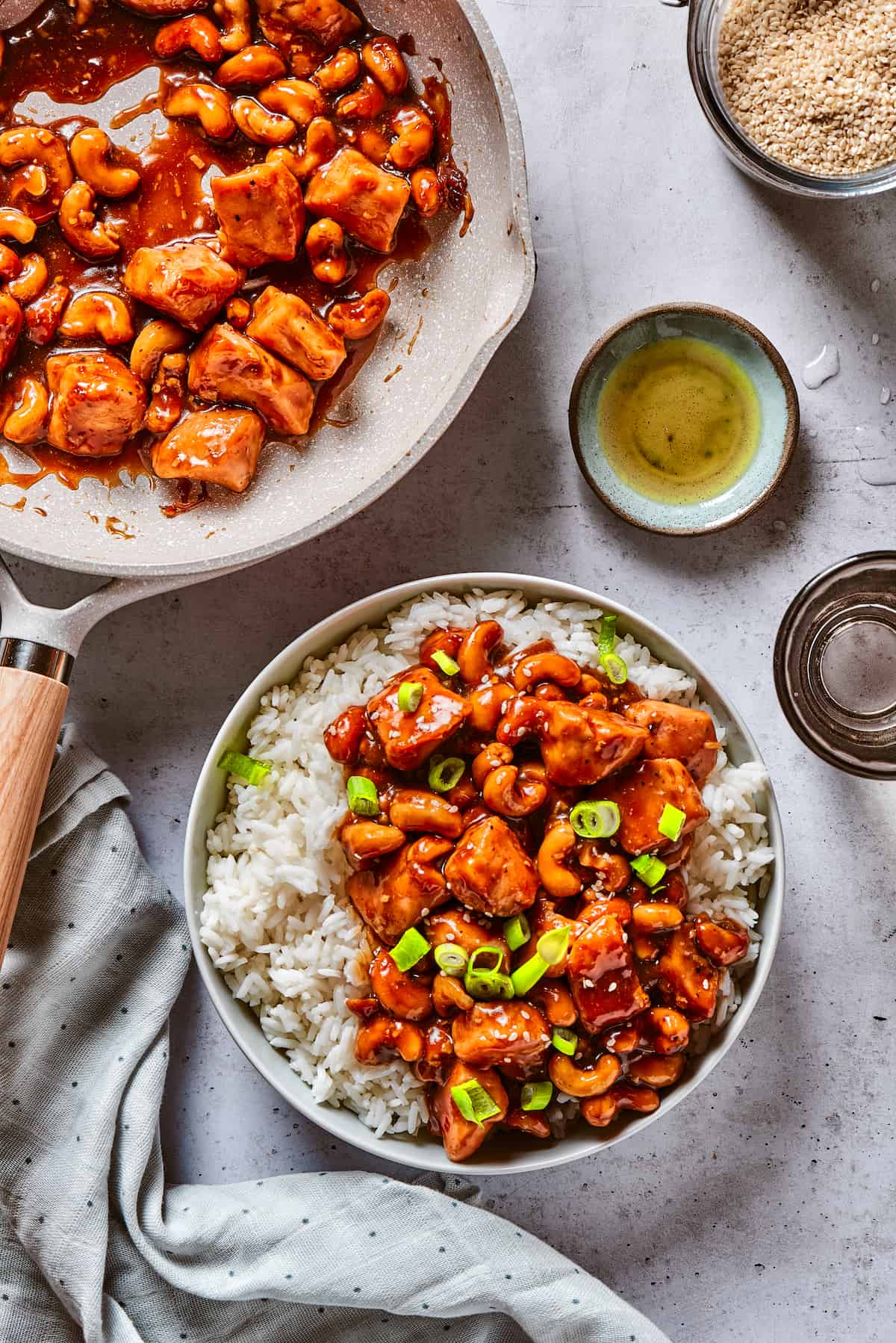 Overhead view of cashew chicken on a plate of rice