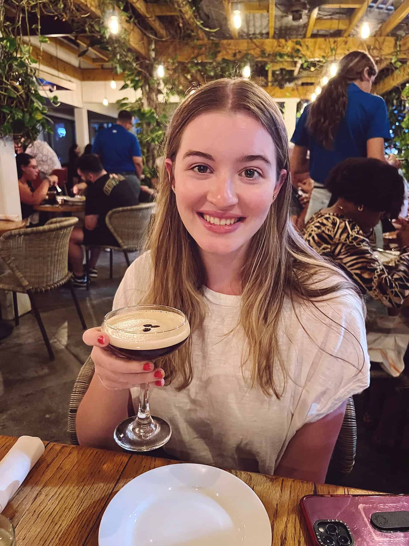 girl holding an espresso martini