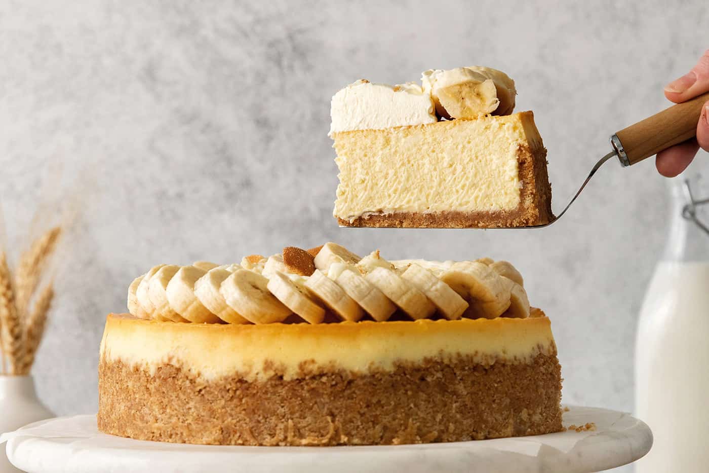 A slice of banana pudding cheesecake being served