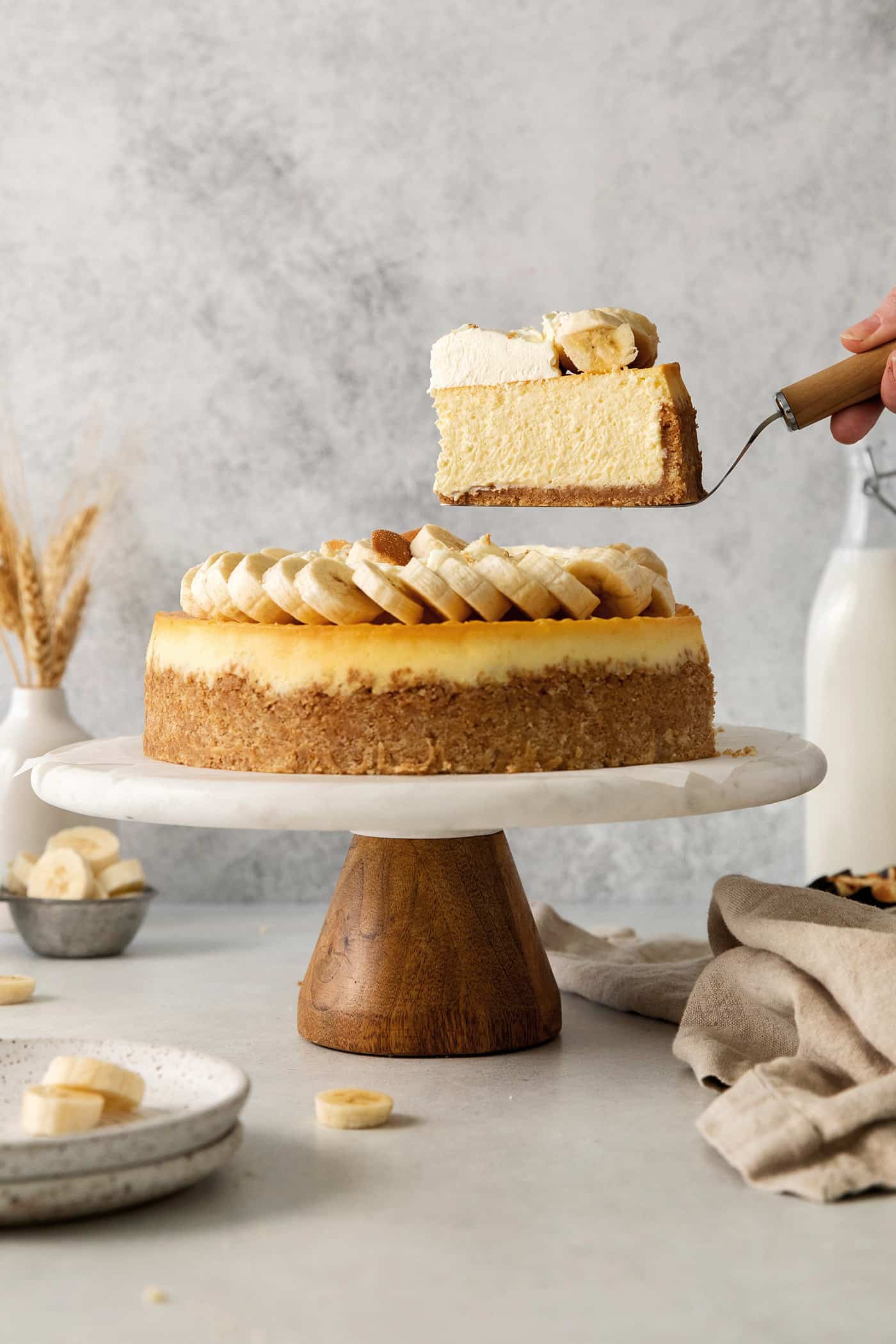 This Banana Pudding Cheesecake features a buttery Nilla wafer crust with a cool and creamy cheesecake filling with sweet banana flavor. A slice of banana pudding cheesecake being served