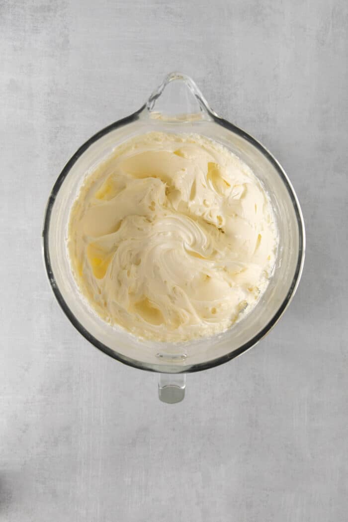 Whipped cream cheese and sugar in am mixing bowl
