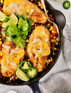 Cowboy chicken skillet with parsley and lime slices
