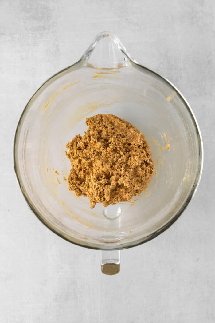 Oatmeal cookie dough in a mixing bowl