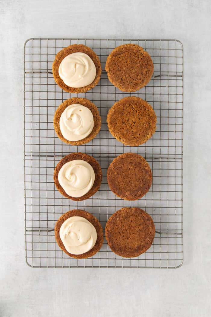 Oatmeal cookies, half topped with creme filling