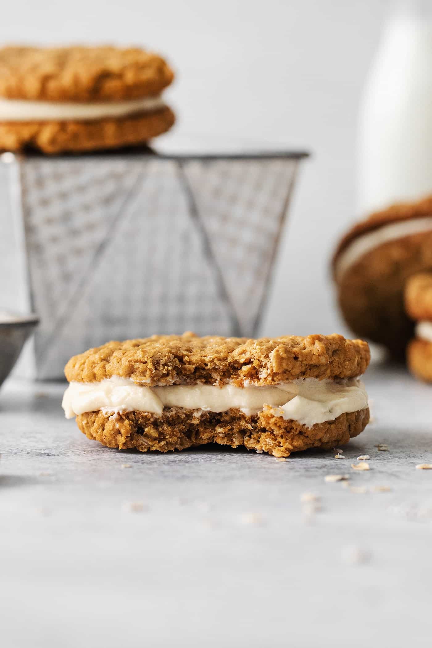 An oatmeal creme pie with a bite missing