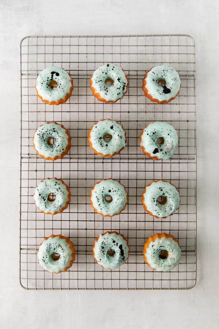 Overhead view of mini bundt cakes topped with icing