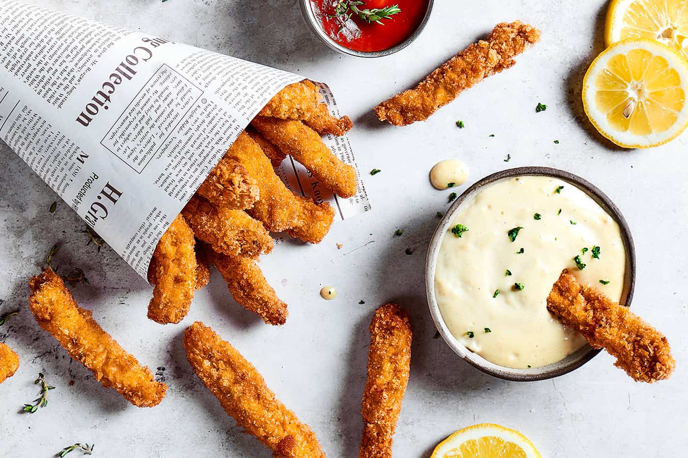 overhead photo of chicken fries, garlic aioli, and ketchup