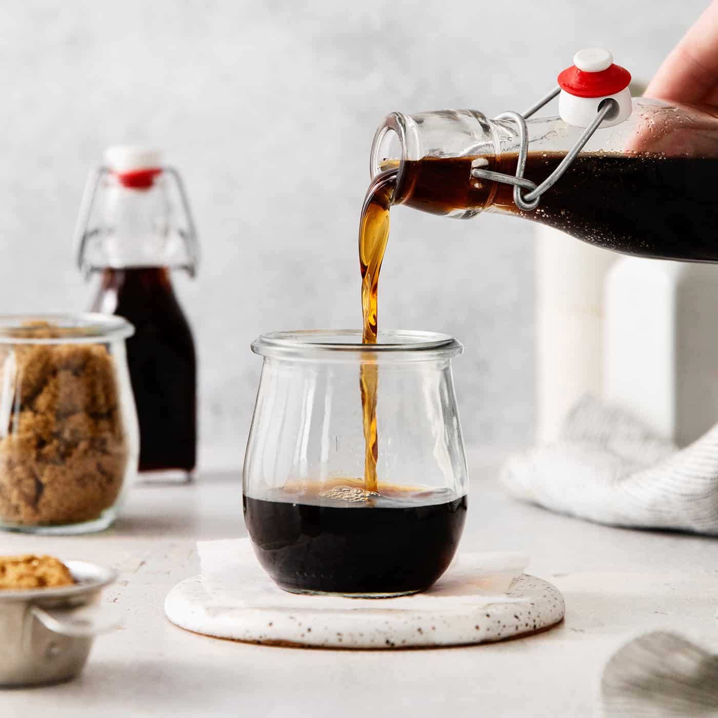 Brown sugar syrup being poured into a glass