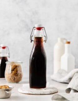 A glass bottle of brown sugar simple syrup