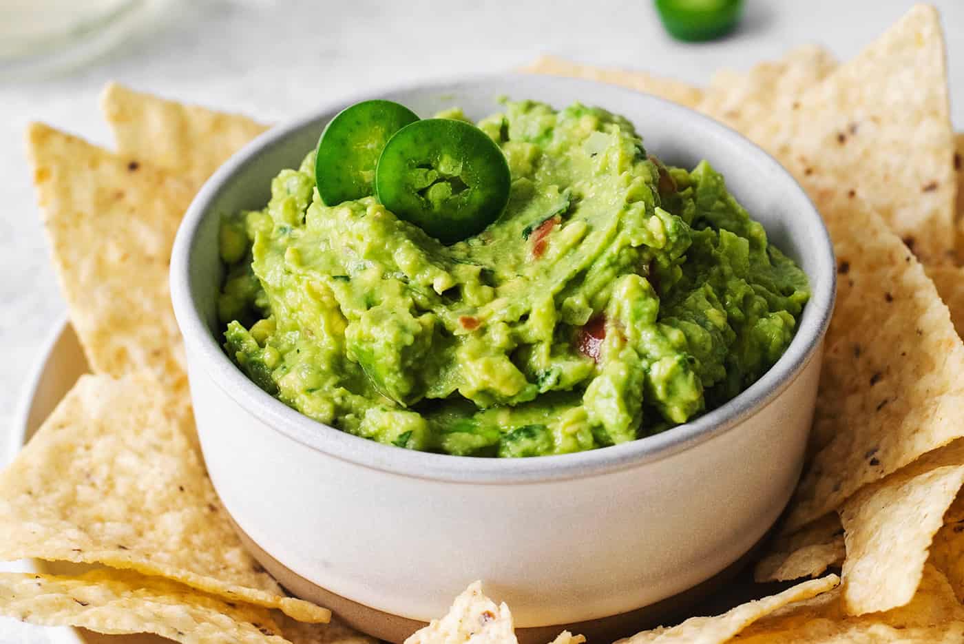 Angled overhead view of a bowl of homemade guacamole