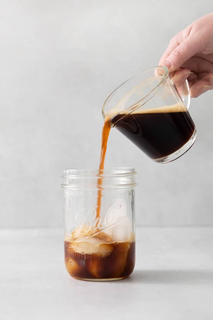 Espresso being poured into a pint jar