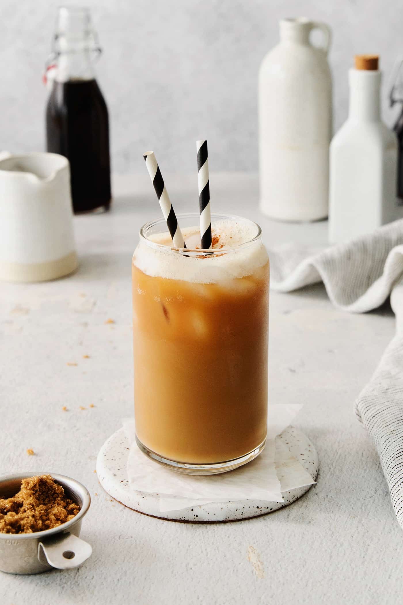 A copycat Starbucks brown sugar shaken espresso with two straws