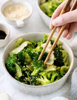 Chopsticks in a bowl of Panda Express super greens