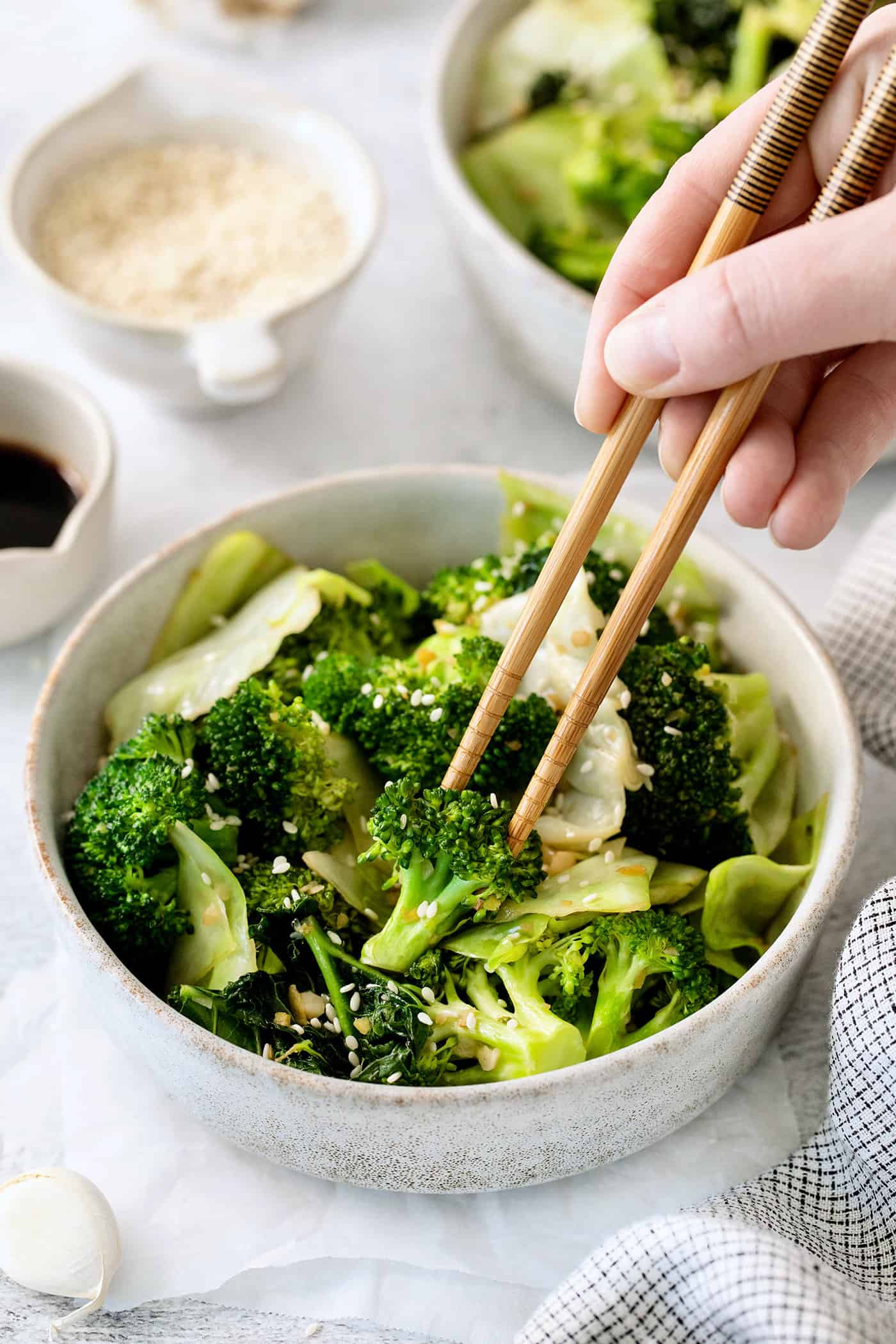 Chopsticks in a bowl of Panda Express super greens
